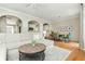 Bright living room with dining room, hardwood floors, and neutral color palette at 4735 Longcourt Se Dr, Atlanta, GA 30339