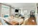 Bright living room featuring an open floor plan, fireplace, and hardwood floors at 4735 Longcourt Se Dr, Atlanta, GA 30339