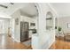 Open-concept living area showcasing the kitchen with a breakfast bar and stairs to the second floor at 4735 Longcourt Se Dr, Atlanta, GA 30339