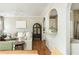 Bright open-concept living space with arched doorways to the kitchen and other living areas at 4735 Longcourt Se Dr, Atlanta, GA 30339