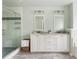 The main bathroom includes double sinks, marble countertops, and a frameless shower at 4735 Longcourt Se Dr, Atlanta, GA 30339