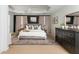 Spacious main bedroom featuring tray ceilings, a large bed, and a walk-in closet at 4735 Longcourt Se Dr, Atlanta, GA 30339