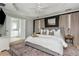 Beautiful main bedroom with tray ceilings, a large bed, and an en-suite bathroom at 4735 Longcourt Se Dr, Atlanta, GA 30339