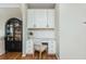 Charming office nook featuring custom cabinetry, granite countertops, and a stylish desk area at 4735 Longcourt Se Dr, Atlanta, GA 30339