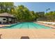 Sparkling community pool with ample lounging space on a sunny day at 4735 Longcourt Se Dr, Atlanta, GA 30339