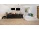 Spacious basement area with large couch, and plenty of room for entertaining at 1023 Bentley Estates Dr, Dacula, GA 30019