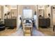 Luxurious bathroom with separate vanities, marble floors, and a soaking tub at 1023 Bentley Estates Dr, Dacula, GA 30019