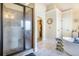 Spa-like bathroom with a glass-enclosed shower and freestanding tub at 1023 Bentley Estates Dr, Dacula, GA 30019