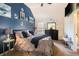 Nautical themed bedroom features a cozy bed, stylish furniture, and tasteful decor at 1023 Bentley Estates Dr, Dacula, GA 30019