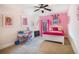 Bright bedroom with colorful accents and a dedicated study area at 1023 Bentley Estates Dr, Dacula, GA 30019