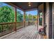 Covered back deck offering outdoor living and beautiful views of the surrounding greenery at 1023 Bentley Estates Dr, Dacula, GA 30019
