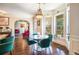 Cozy dining area with hardwood floors, a bay window, and views of the outdoor deck at 1023 Bentley Estates Dr, Dacula, GA 30019