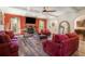 Elegant living room with a stone fireplace, wood floors, and coffered ceilings at 1023 Bentley Estates Dr, Dacula, GA 30019