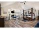 A spacious main bedroom with high ceilings, hardwood floors, and a fireplace at 1023 Bentley Estates Dr, Dacula, GA 30019