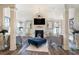 Comfortable sitting area with a fireplace, television, and accent furniture at 1023 Bentley Estates Dr, Dacula, GA 30019