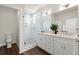 Modern bathroom with a glass shower, double vanity, and contemporary fixtures at 1123 W Marietta St, Atlanta, GA 30318