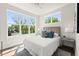 Sun-lit bedroom featuring hardwood floors, large windows, and stylish furnishings at 1123 W Marietta St, Atlanta, GA 30318