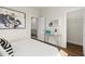 Bedroom featuring hardwood floors, modern art, and ample closet space at 1123 W Marietta St, Atlanta, GA 30318