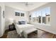 Sun-filled bedroom featuring hardwood floors, large windows, and a cozy decor at 1123 W Marietta St, Atlanta, GA 30318