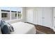 Bedroom with hardwood floors, large window and a double door closet at 1123 W Marietta St, Atlanta, GA 30318