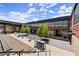 Inviting outdoor courtyard featuring benches, tables, and landscaping with contemporary architecture in the background at 1123 W Marietta St, Atlanta, GA 30318