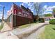 Rustic brick building with vintage signage, surrounded by green lawn and gravel driveway at 1123 W Marietta St, Atlanta, GA 30318