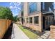 Brick home exterior showcasing landscaping, a walkway, and sleek modern design at 1123 W Marietta St, Atlanta, GA 30318