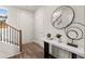 Stylish foyer featuring hardwood floors, modern console table, and staircase with wood and metal at 1123 W Marietta St, Atlanta, GA 30318