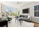 Bright living room featuring large windows, modern furnishings, and neutral decor at 1123 W Marietta St, Atlanta, GA 30318