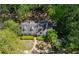 Charming home with a well-maintained yard and mature trees, creating a serene and private setting at 1711 Homestead Ne Ave, Atlanta, GA 30306
