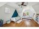 Bright bedroom featuring hardwood floors, two beds, and creative wall decor at 1711 Homestead Ne Ave, Atlanta, GA 30306