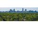 Enjoy stunning skyline views from your new home, set against a backdrop of lush greenery and mature trees at 1711 Homestead Ne Ave, Atlanta, GA 30306