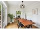Stylish dining room with hardwood floors and an open view to the living room at 1711 Homestead Ne Ave, Atlanta, GA 30306
