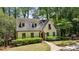 Charming home with dormer windows, stone accents, and a well-maintained lawn at 1711 Homestead Ne Ave, Atlanta, GA 30306