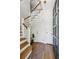Bright foyer with hardwood floors, staircase, and white trim at 1711 Homestead Ne Ave, Atlanta, GA 30306