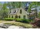 Charming two-story home with a classic facade, manicured landscaping, and inviting curb appeal at 1711 Homestead Ne Ave, Atlanta, GA 30306