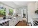 Bright kitchen with stainless steel appliances, stone countertops, and hardwood flooring at 1711 Homestead Ne Ave, Atlanta, GA 30306