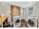 Laundry room with washer, dryer, and storage at 1711 Homestead Ne Ave, Atlanta, GA 30306