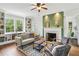 Inviting living room with a fireplace, built-in shelves, and ample natural light at 1711 Homestead Ne Ave, Atlanta, GA 30306