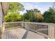 Enjoy outdoor living on this wood back deck surrounded by beautiful trees and lush greenery at 327 6Th Ne St, Atlanta, GA 30308