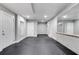 Spacious basement with a concrete floor, white walls, a large mirror and a neutral color palette at 327 6Th Ne St, Atlanta, GA 30308