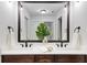 Elegant bathroom with double sinks, dark wood cabinetry, and a large mirror at 327 6Th Ne St, Atlanta, GA 30308