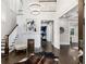 Grand foyer featuring hardwood floors, fireplace, and stunning chandelier at 327 6Th Ne St, Atlanta, GA 30308