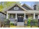 Charming craftsman-style home features a welcoming front porch and professionally landscaped yard at 327 6Th Ne St, Atlanta, GA 30308