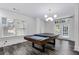 Spacious game room with modern lighting and a versatile pool table at 327 6Th Ne St, Atlanta, GA 30308