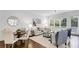 Bright living room with hardwood floors, neutral colors, and abundant natural light at 327 6Th Ne St, Atlanta, GA 30308