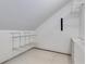 Unfinished attic storage space with built in shelving, perfect for seasonal storage at 327 6Th Ne St, Atlanta, GA 30308