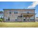 Spacious brick home with a covered patio and a large grassy backyard at 1600 Kamp Springs Ave, Lawrenceville, GA 30045
