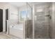 Modern bathroom with a separate glass shower and soaking tub showcasing luxury design at 1600 Kamp Springs Ave, Lawrenceville, GA 30045