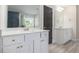 Elegant bathroom featuring double vanities, granite countertops, and modern fixtures at 1600 Kamp Springs Ave, Lawrenceville, GA 30045